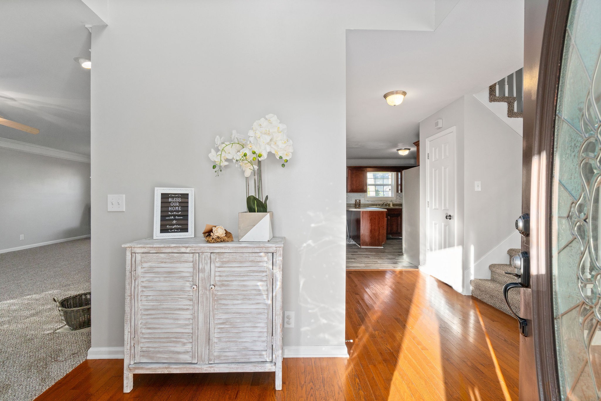 3430 Old Timber Road Clarksville, TN 37042 - Photo 3 of 33 a view of a hallway that has hardwood floor and a chandelier