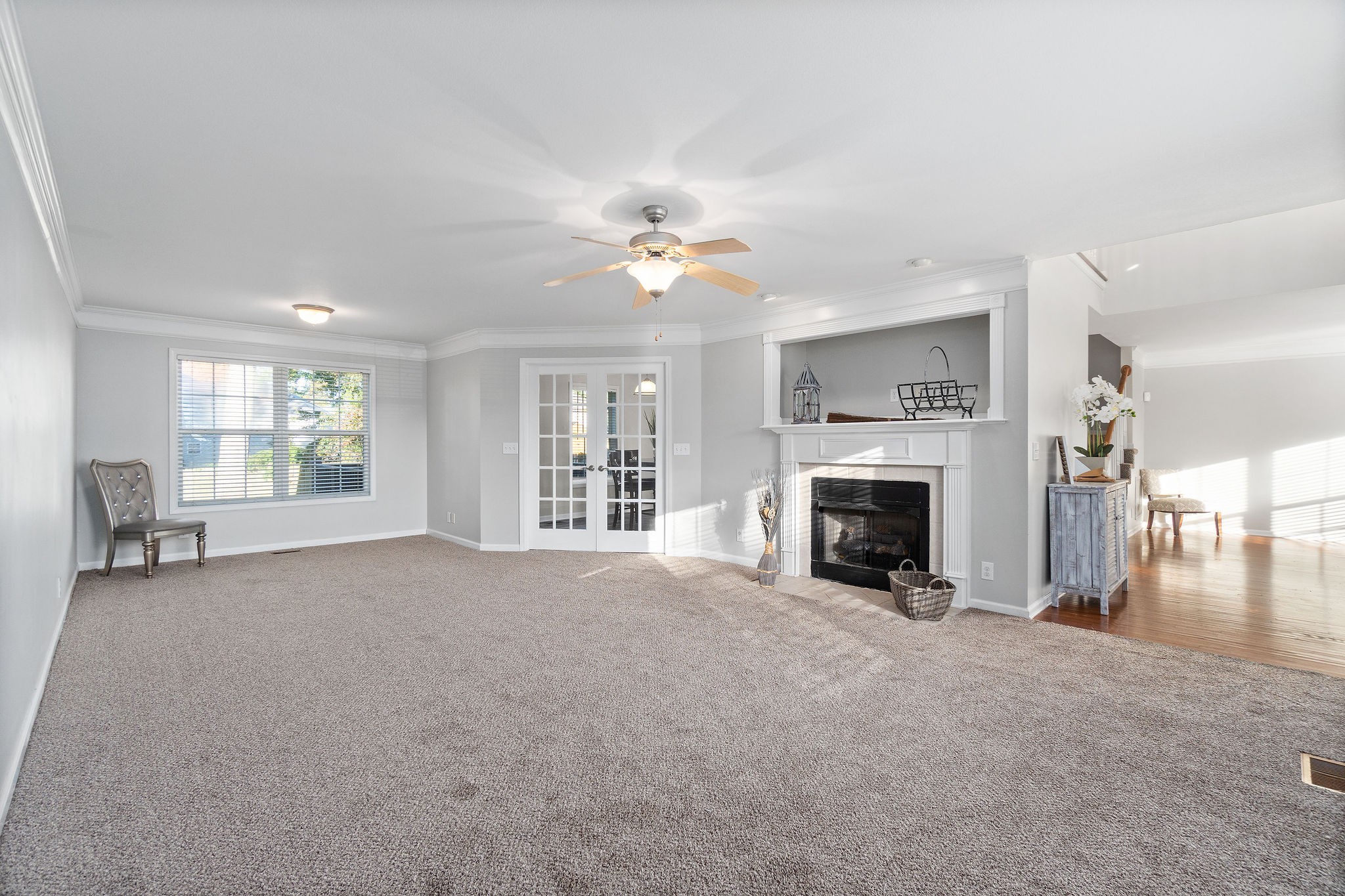 3430 Old Timber Road Clarksville, TN 37042 - Photo 5 of 33 a view of a livingroom with a fireplace a ceiling fan and windows