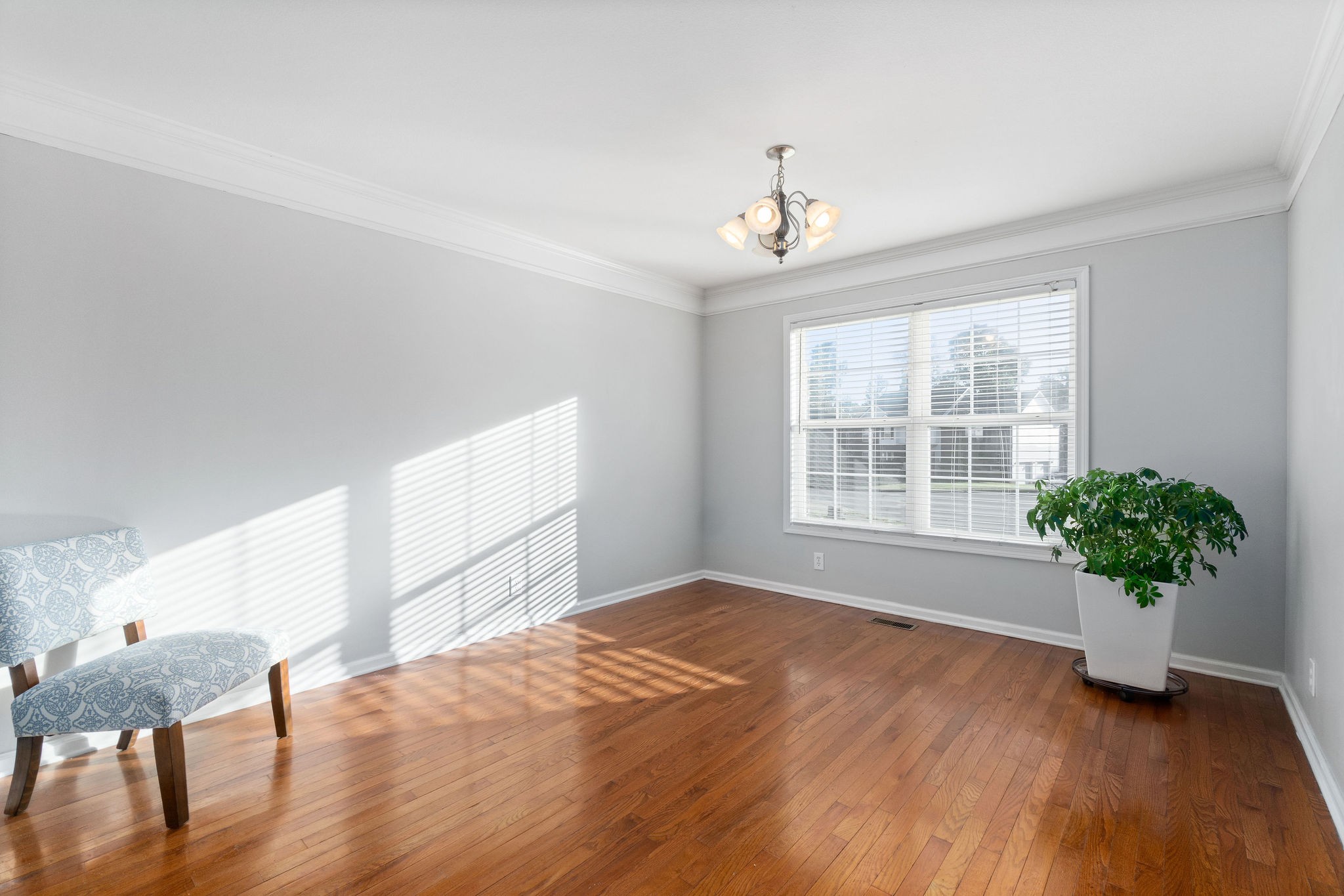 3430 Old Timber Road Clarksville, TN 37042 - Photo 8 of 33 a view of an empty room with a window and wooden floor