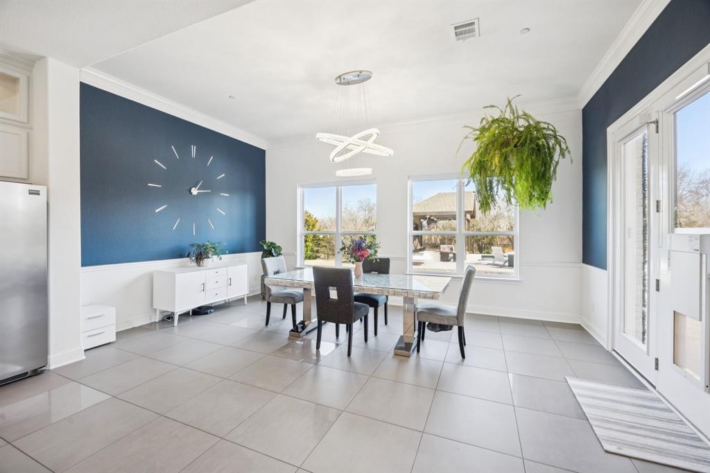 330 Bonham Boulevard Fairview, TX 75069 - Photo 11 of 32 a dining room with furniture and a large window