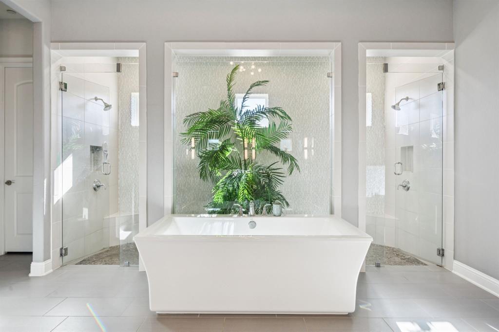 330 Bonham Boulevard Fairview, TX 75069 - Photo 13 of 32 a white bath tub sitting in a bathroom
