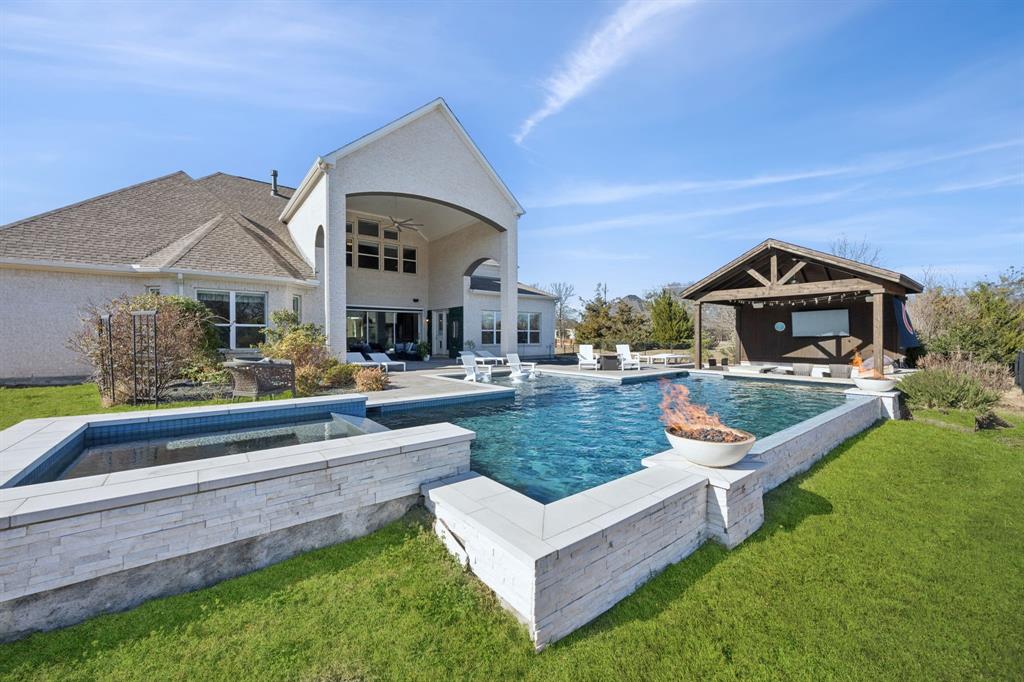 330 Bonham Boulevard Fairview, TX 75069 - Photo 26 of 32 a front view of a house with swimming pool and yard