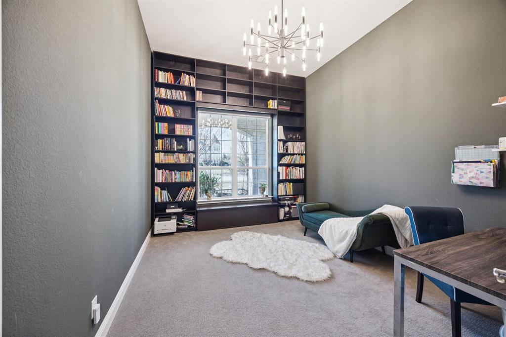 330 Bonham Boulevard Fairview, TX 75069 - Photo 4 of 32 a bedroom with furniture and a chandelier