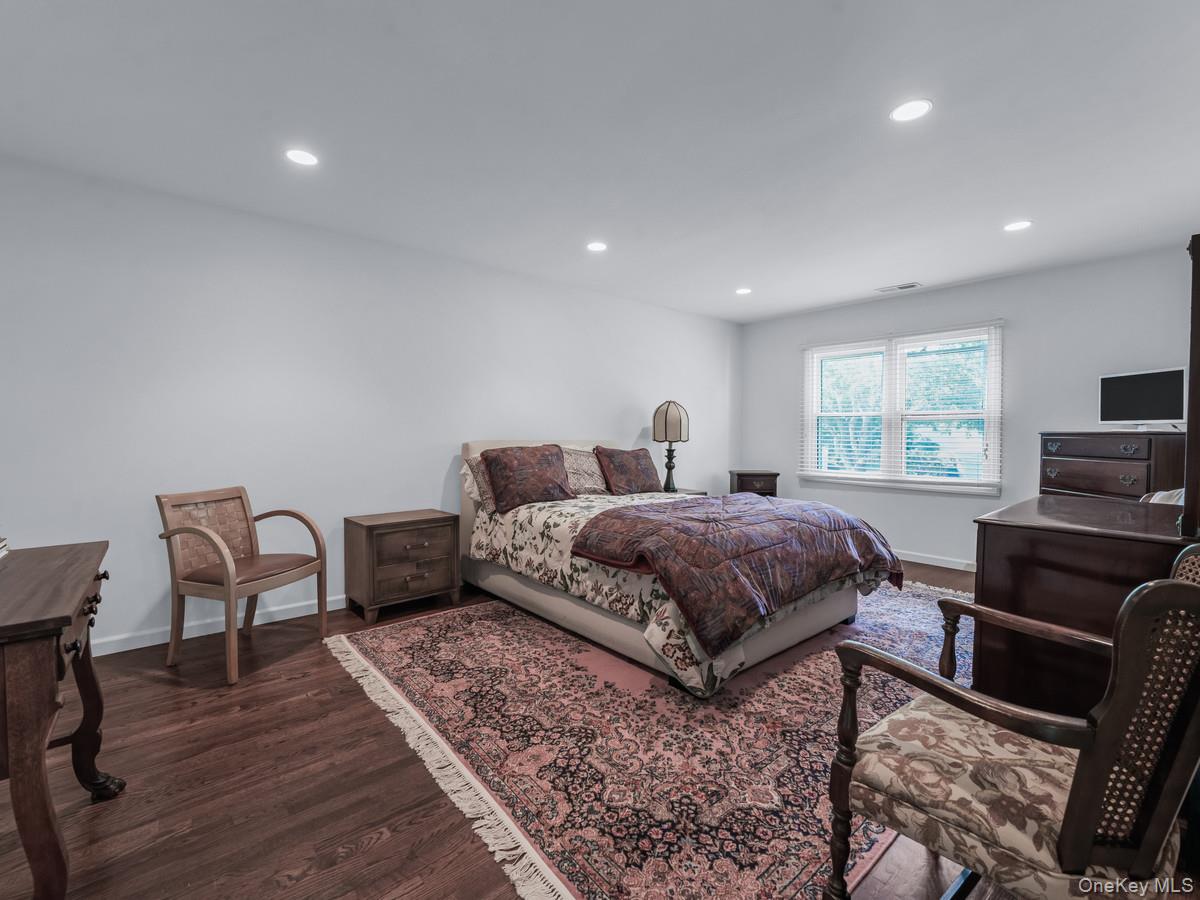 15 Fairway Circle South, Unit 15 Manhasset, NY 11030 - Photo 26 of 39 Second Floor Bedroom featuring dark wood-type flooring and recessed lighting
