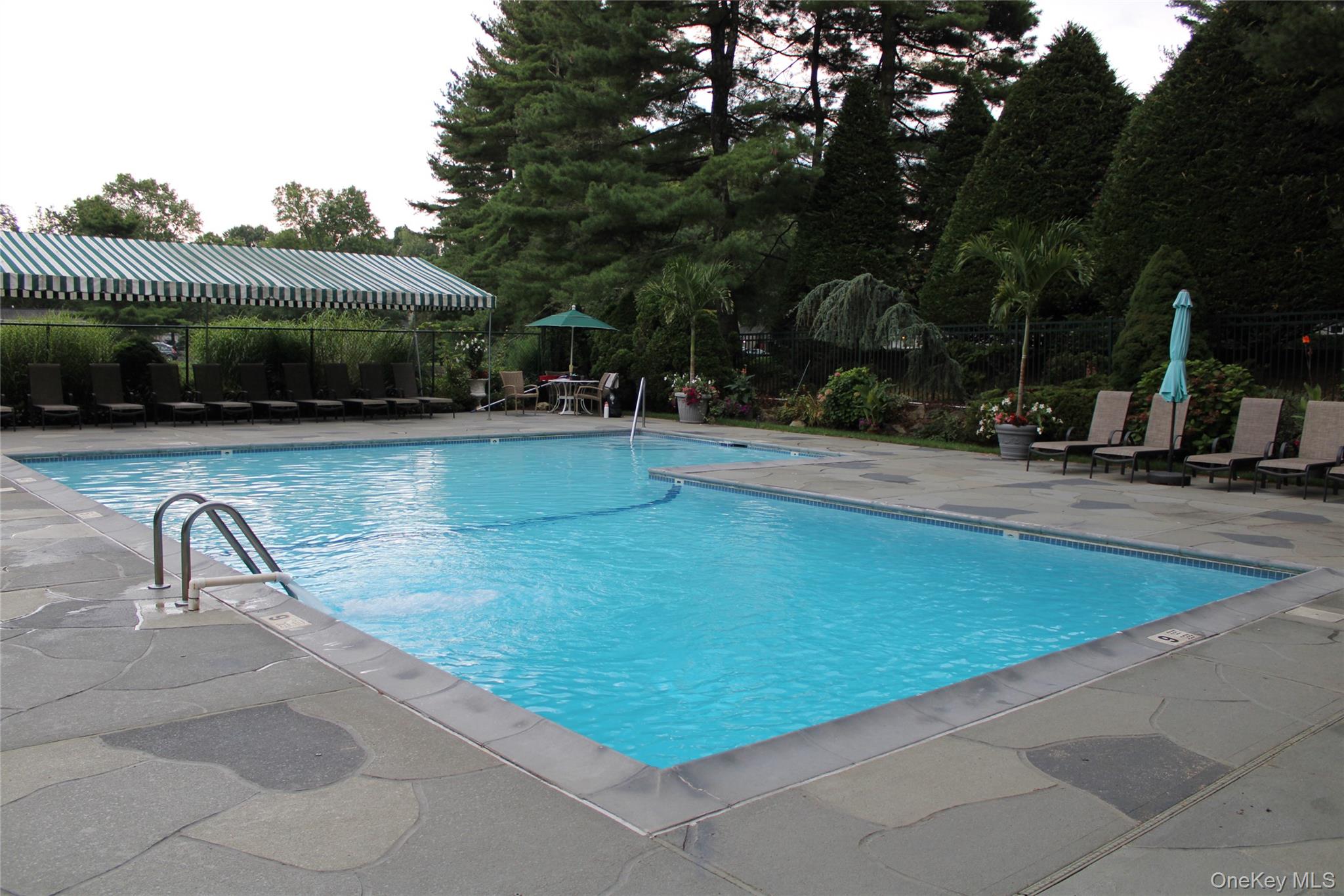 15 Fairway Circle South, Unit 15 Manhasset, NY 11030 - Photo 34 of 39 Community pool with a patio