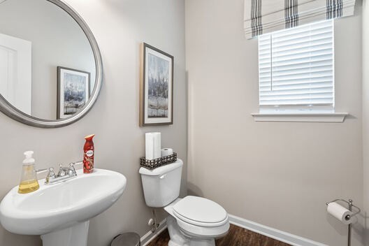 Undisclosed Address Antioch, TN 37013 - Photo 7 of 21 a bathroom with a toilet a sink and a mirror