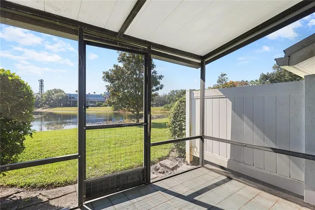a view of a porch with a floor to ceiling windows