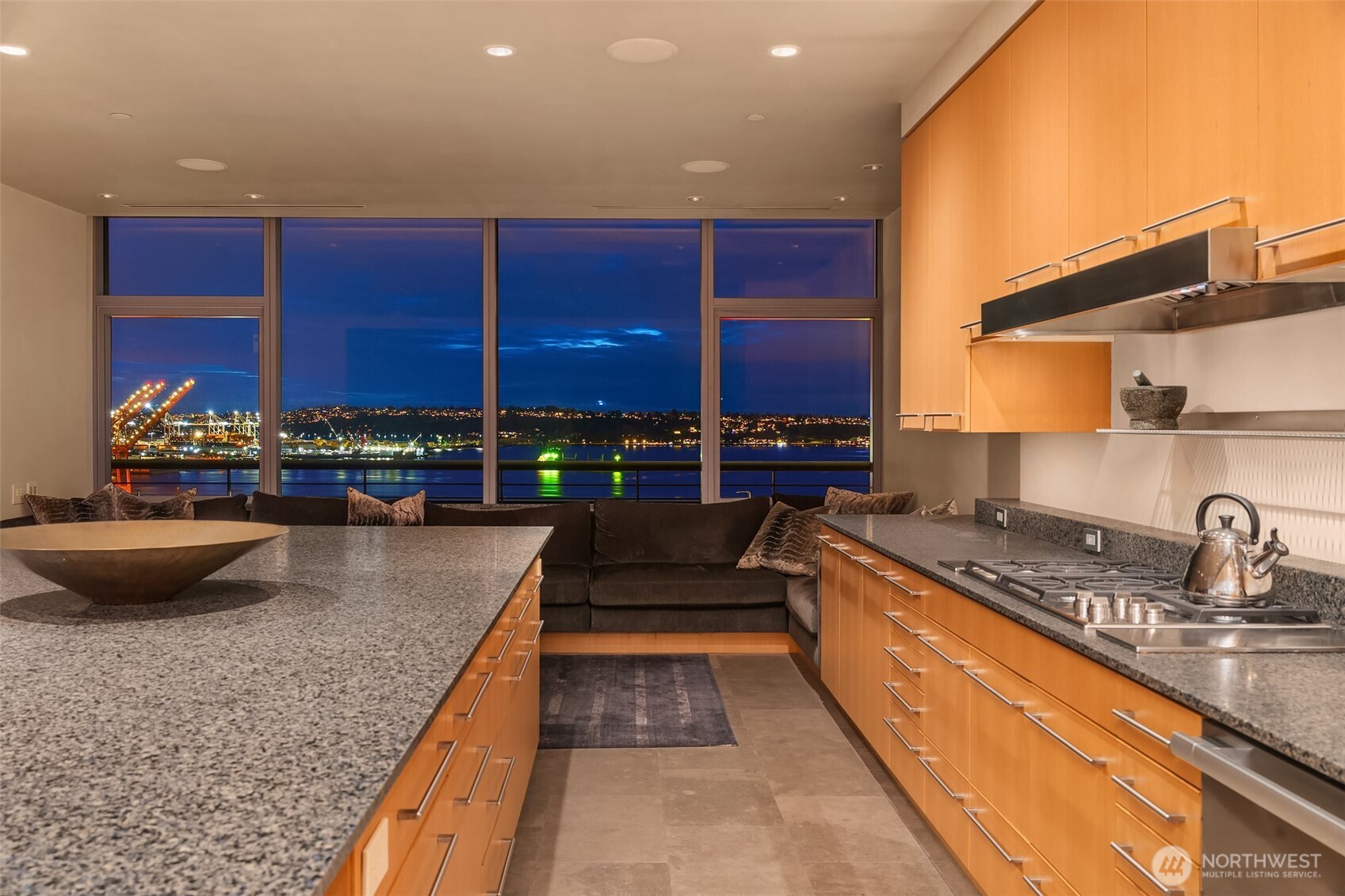 715 2nd Avenue, Unit 1501 Seattle, WA 98104 - Photo 12 of 40 a kitchen with stainless steel appliances granite countertop a sink and cabinets
