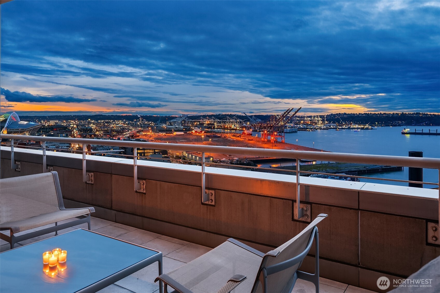 715 2nd Avenue, Unit 1501 Seattle, WA 98104 - Photo 15 of 40 a view of a chairs and table in a balcony