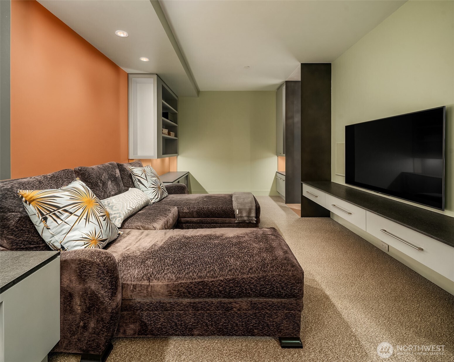 715 2nd Avenue, Unit 1501 Seattle, WA 98104 - Photo 24 of 40 a living room with furniture and a flat screen tv
