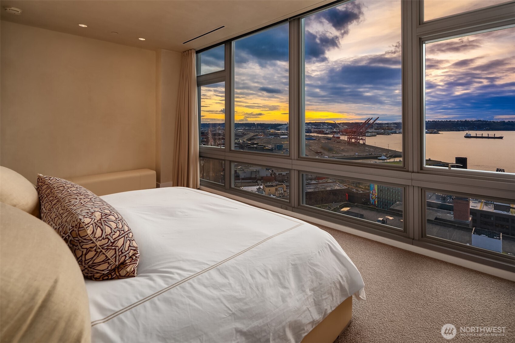 715 2nd Avenue, Unit 1501 Seattle, WA 98104 - Photo 25 of 40 a bedroom with a large bed and a large window