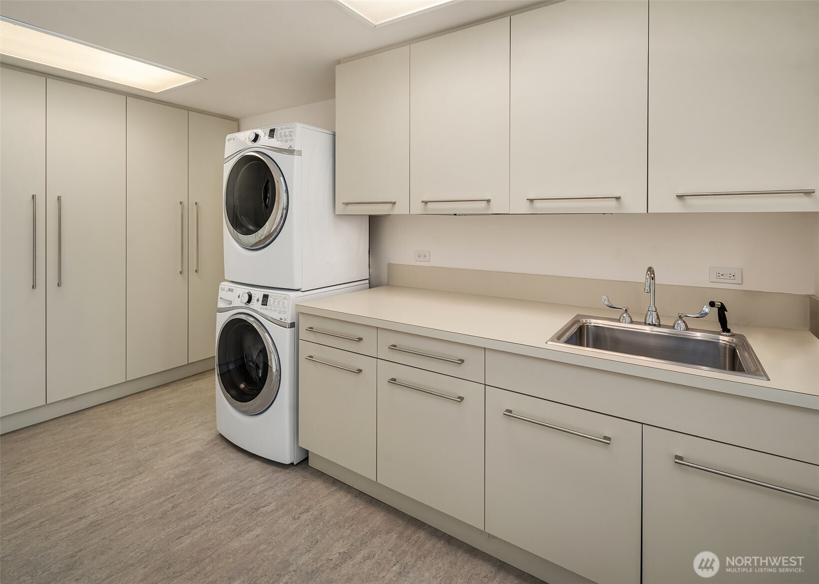 715 2nd Avenue, Unit 1501 Seattle, WA 98104 - Photo 37 of 40 a utility room with sink dryer and washer