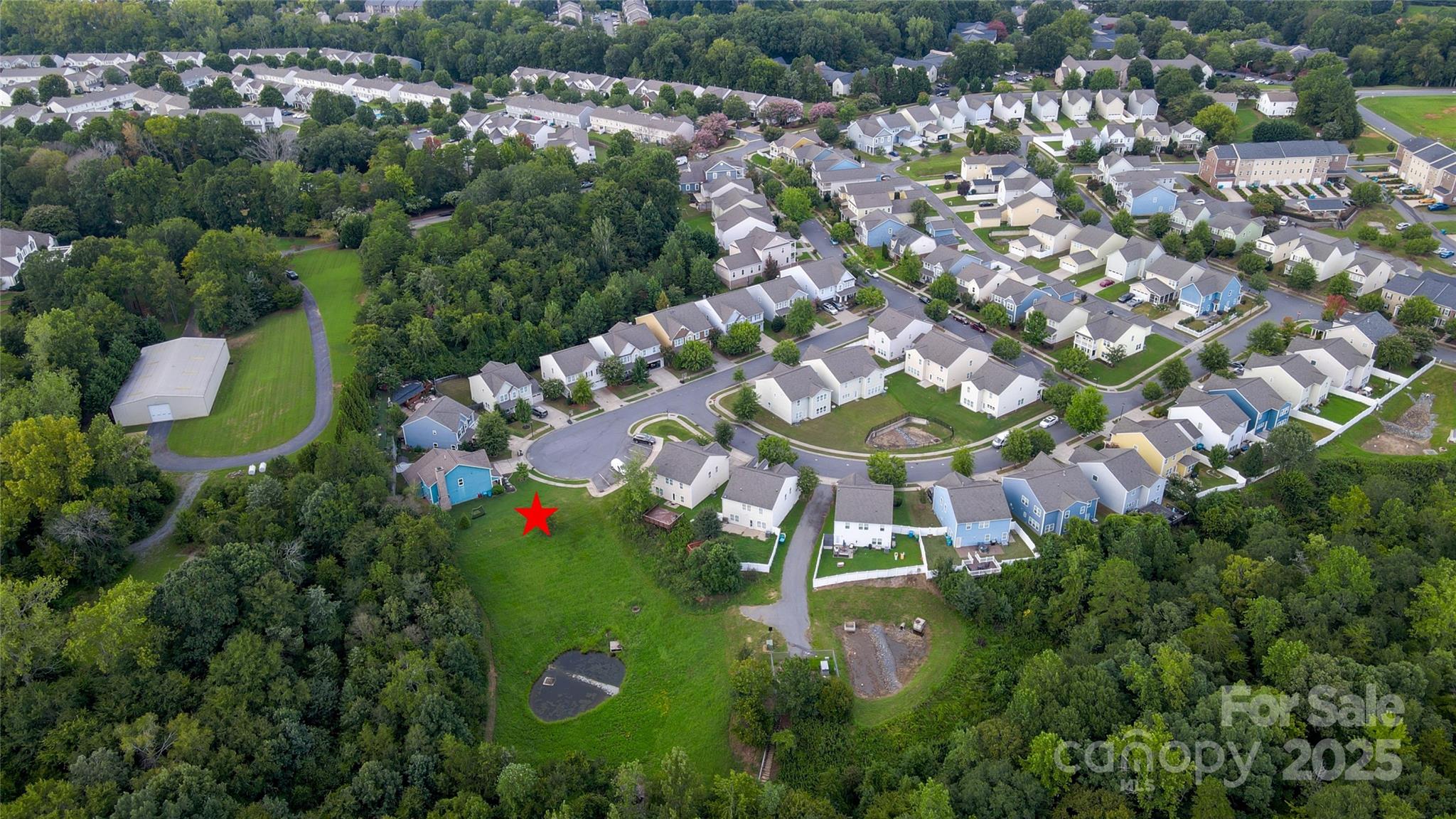 10329 Killogrin Way, Unit 15 Pineville, NC 28134 - Photo 4 of 5 an aerial view of a house with a yard and lake view