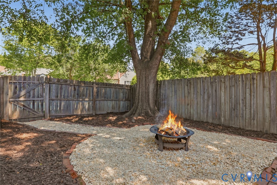 22 Ashinghurst Road, Unit 22 Henrico, VA 23238 - Photo 23 of 25 a backyard of a house with yard and outdoor seating