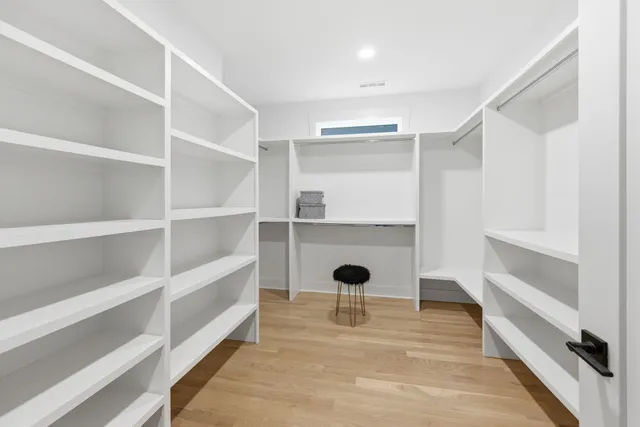 a bathroom with a sink toilet and window