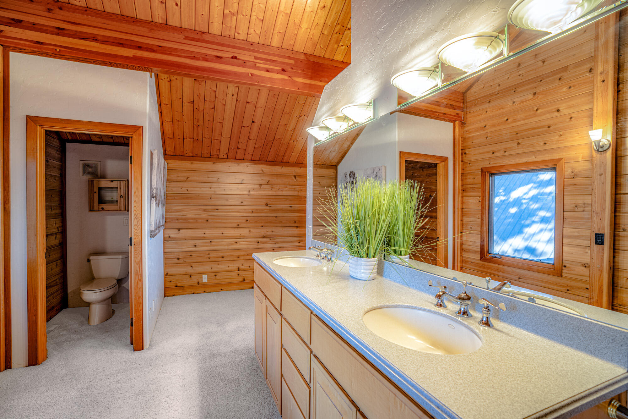 60647 Antler Road Bend, OR 97702 - Photo 27 of 44 a bathroom with a sink and a mirror