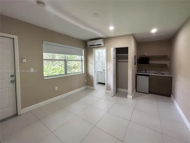 a view of a kitchen with a sink dishwasher stove and refrigerator