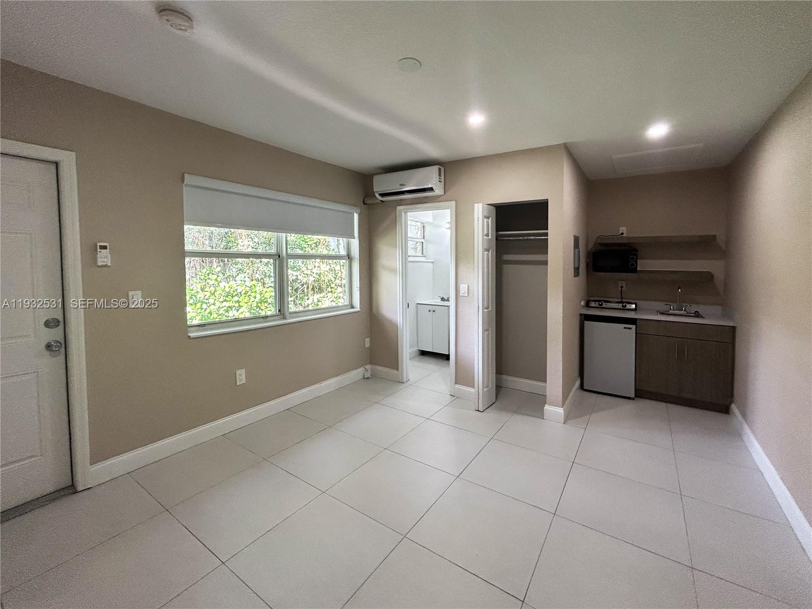 a view of a kitchen with a sink dishwasher stove and refrigerator