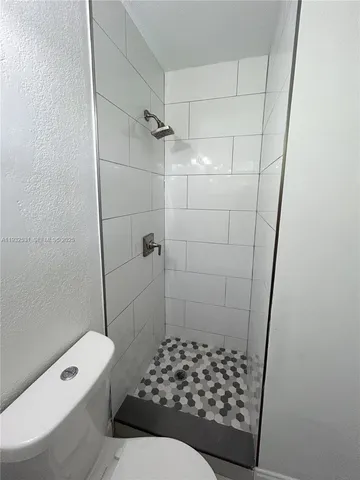 a bathroom with a bathtub and shower