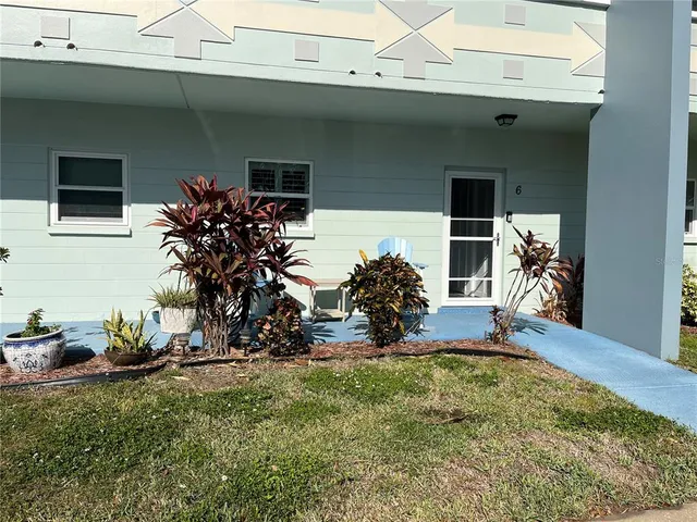 a view of a entryway with flower pots