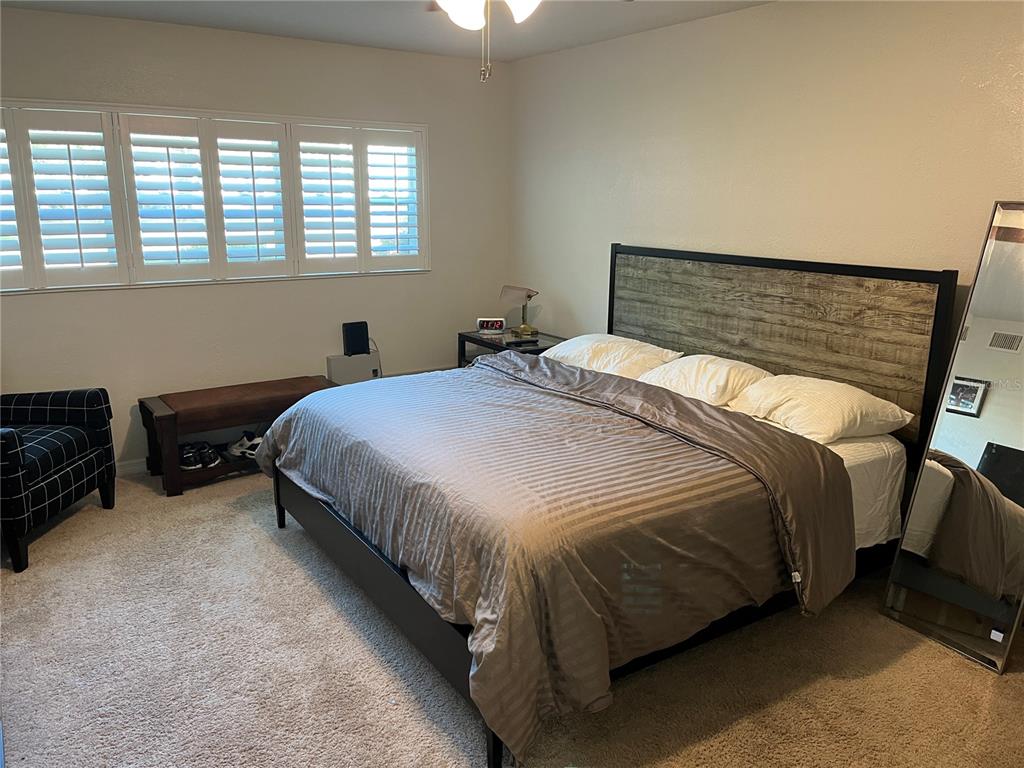 2254 Norwegian Drive, Unit 6 Clearwater, FL 33763 - Photo 19 of 56 a bedroom with a bed and a window
