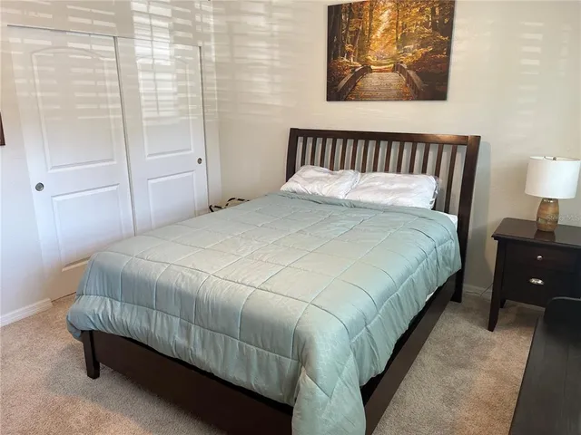 a bathroom with a shower a toilet and a shower