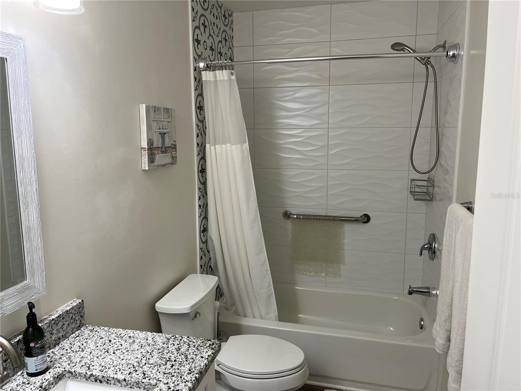 2254 Norwegian Drive, Unit 6 Clearwater, FL 33763 - Photo 28 of 56 a bathroom with a shower a toilet and a shower