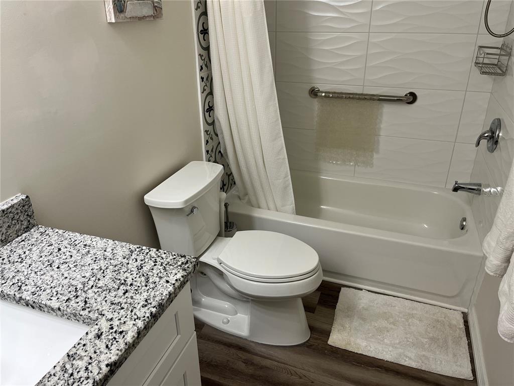 2254 Norwegian Drive, Unit 6 Clearwater, FL 33763 - Photo 29 of 56 a bathroom with a toilet and a shower