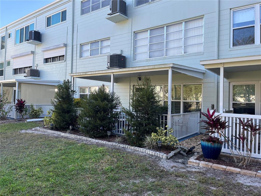 2254 Norwegian Drive, Unit 6 Clearwater, FL 33763 - Photo 34 of 56 a front view of a house with a yard