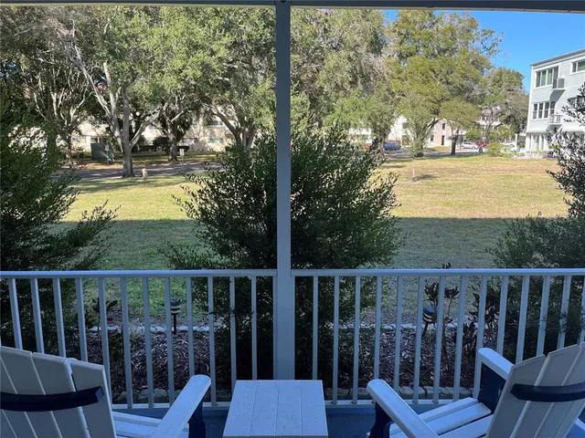 a view of a garden with an outdoor seating