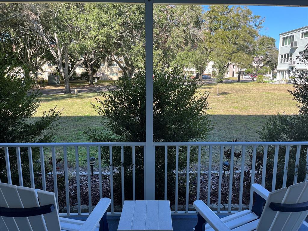 2254 Norwegian Drive, Unit 6 Clearwater, FL 33763 - Photo 35 of 56 a view of a chair and table in the balcony