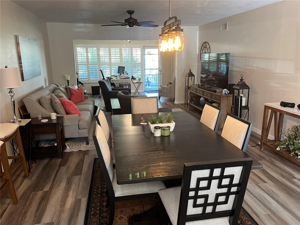 2254 Norwegian Drive, Unit 6 Clearwater, FL 33763 - Photo 7 of 56 a view of a dining room with furniture window and wooden floor