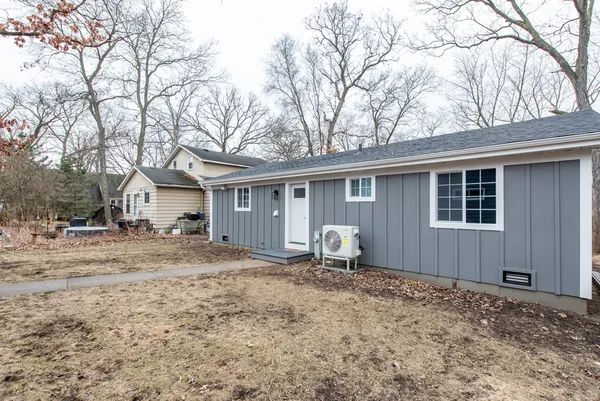 a house with trees in the background
