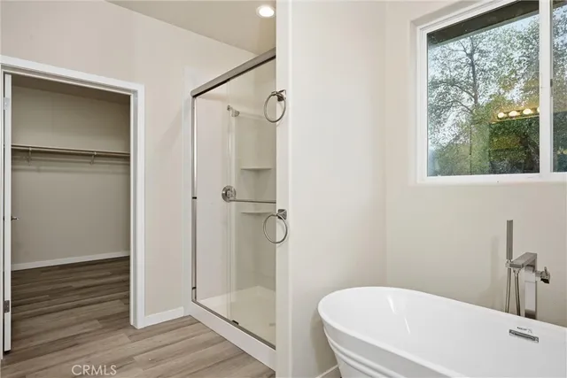 a white bath tub sitting next to a white sink
