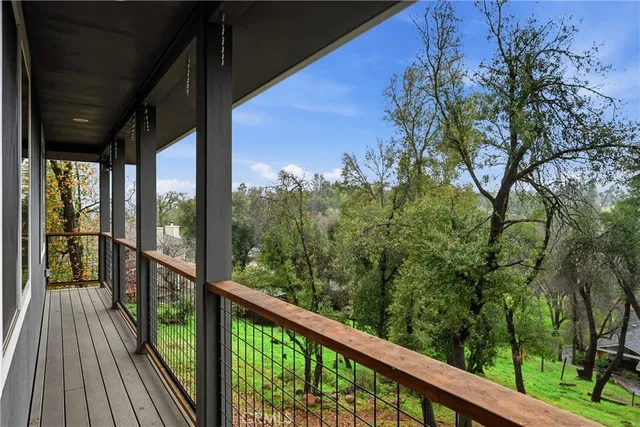 a view of balcony with wooden floor