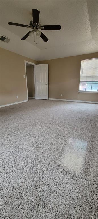 3031 Modella Avenue Dallas, TX 75229 - Photo 12 of 15 Unfurnished bedroom with speckled floor and a ceiling fan