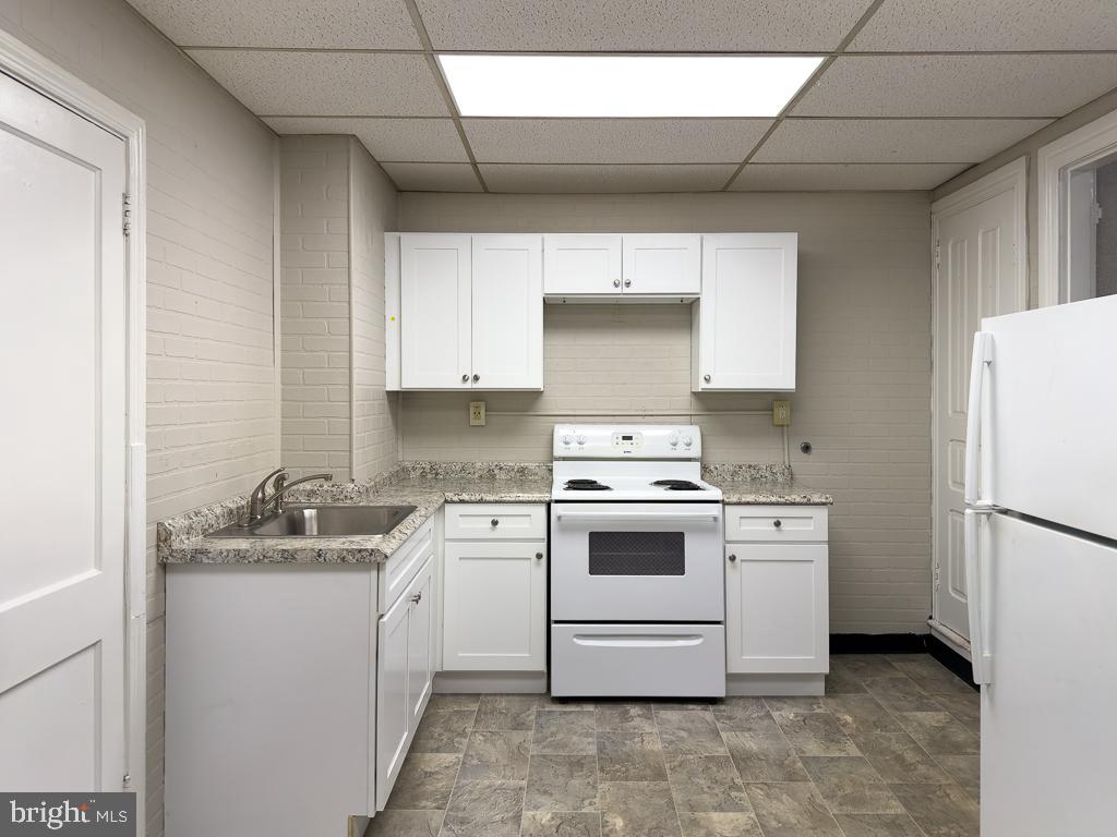 658 Walnut Street, Unit 1 Pottstown, PA 19464 - Photo 1 of 19 a kitchen with a stove sink and refrigerator
