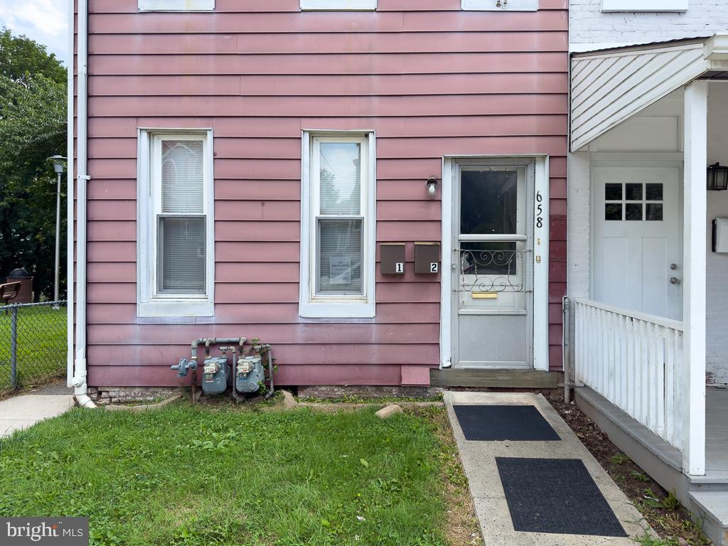 658 Walnut Street, Unit 1 Pottstown, PA 19464 - Photo 18 of 19 a view of front door of a house with a yard