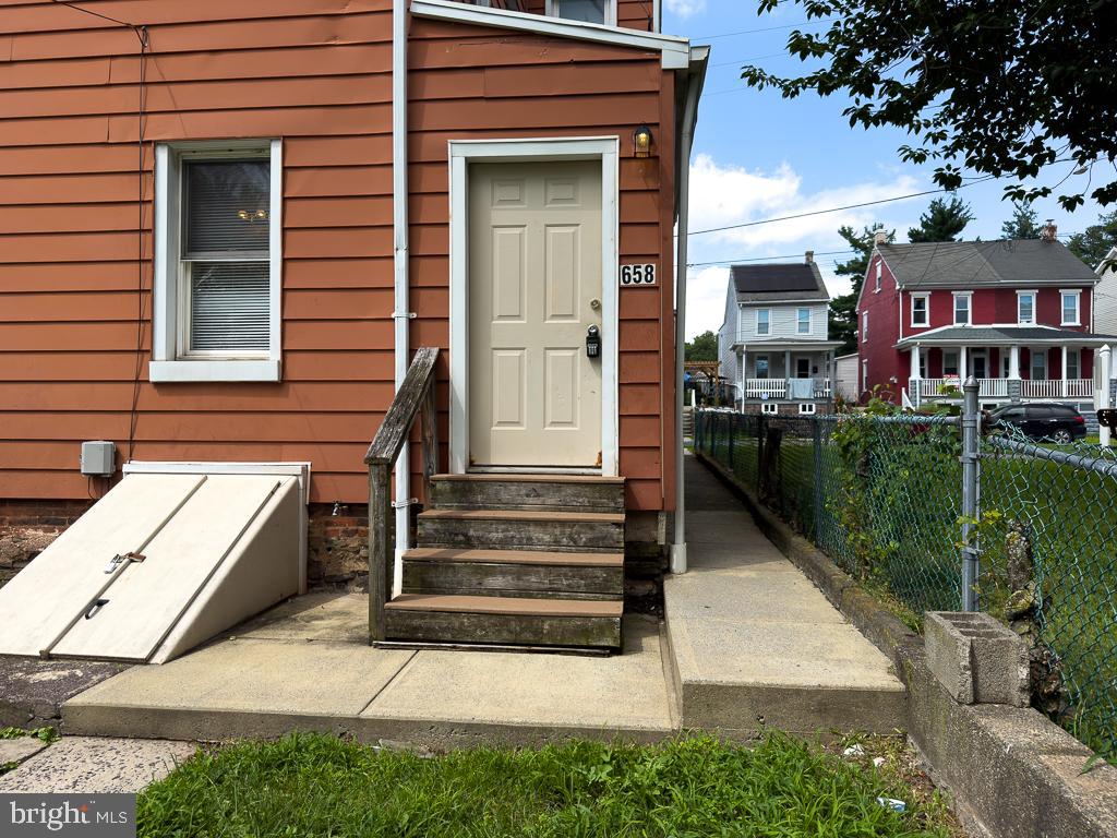 658 Walnut Street, Unit 1 Pottstown, PA 19464 - Photo 19 of 19 a view of a house with a yard