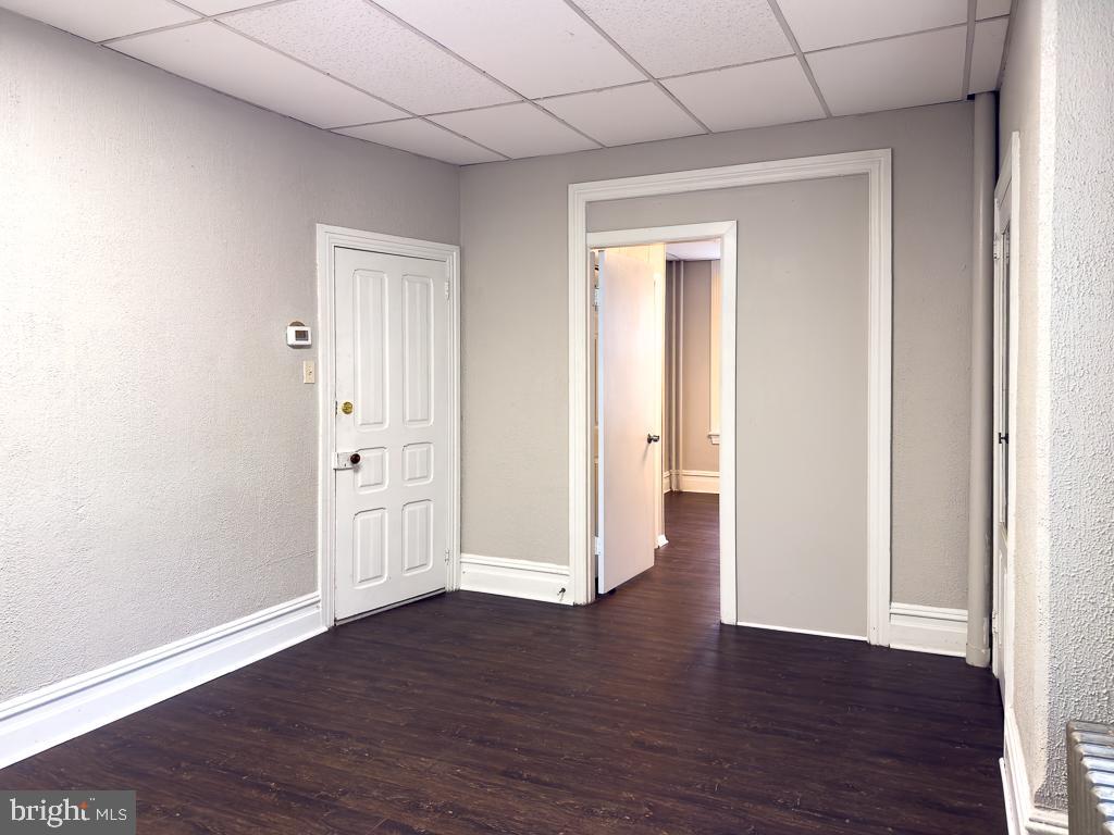 658 Walnut Street, Unit 1 Pottstown, PA 19464 - Photo 7 of 19 a view of an empty room with wooden floor