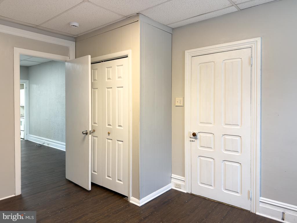 658 Walnut Street, Unit 1 Pottstown, PA 19464 - Photo 10 of 19 an empty room with wooden floor & closet area