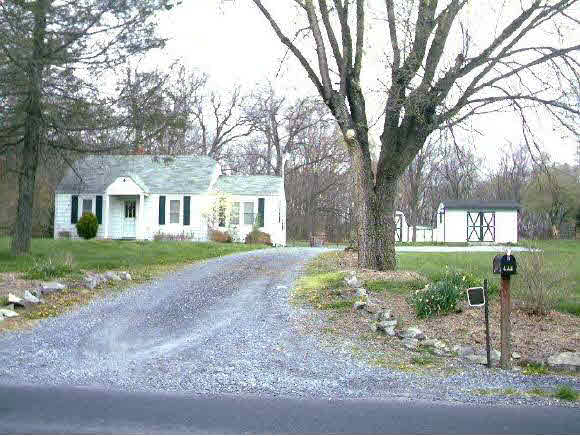 a house with trees in the background