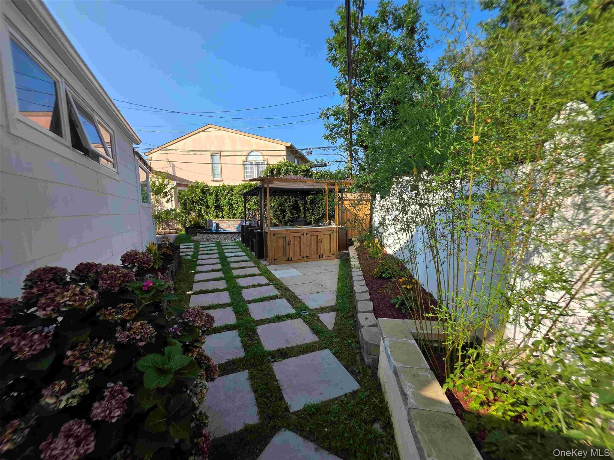 30 Aberdeen Road New Hyde Park, NY 11040 - Photo 14 of 37 a view of swimming pool with a patio
