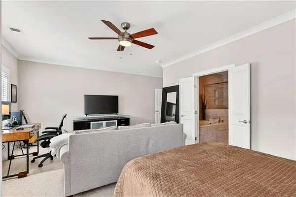 a bedroom with a bed and furniture