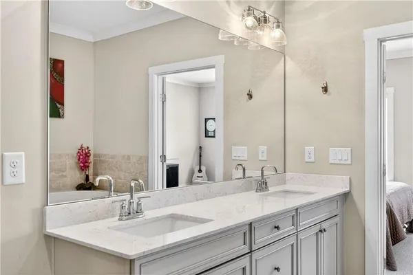 a bathroom with a sink vanity and a mirror