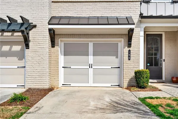 a view of a house with a yard and sitting area
