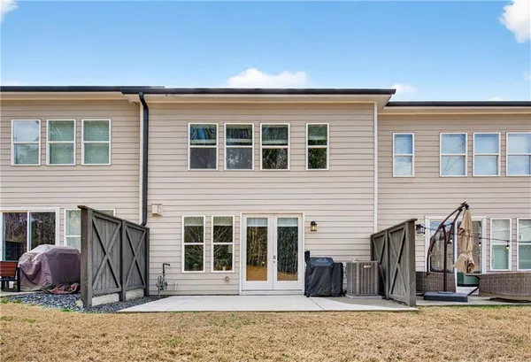 a front view of a house with a barbeque