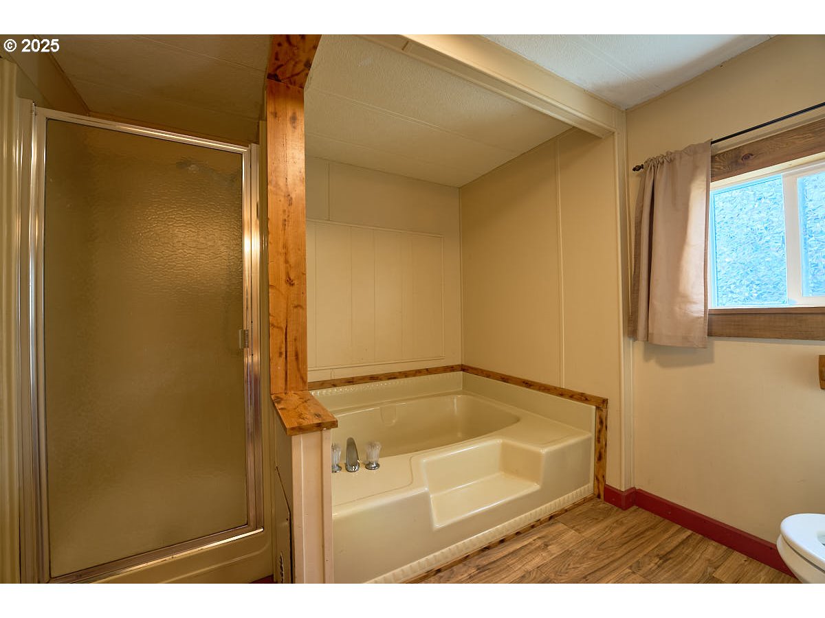 402 South East Street Joseph, OR 97846 - Photo 11 of 22 a bathroom with a shower and a bath tub