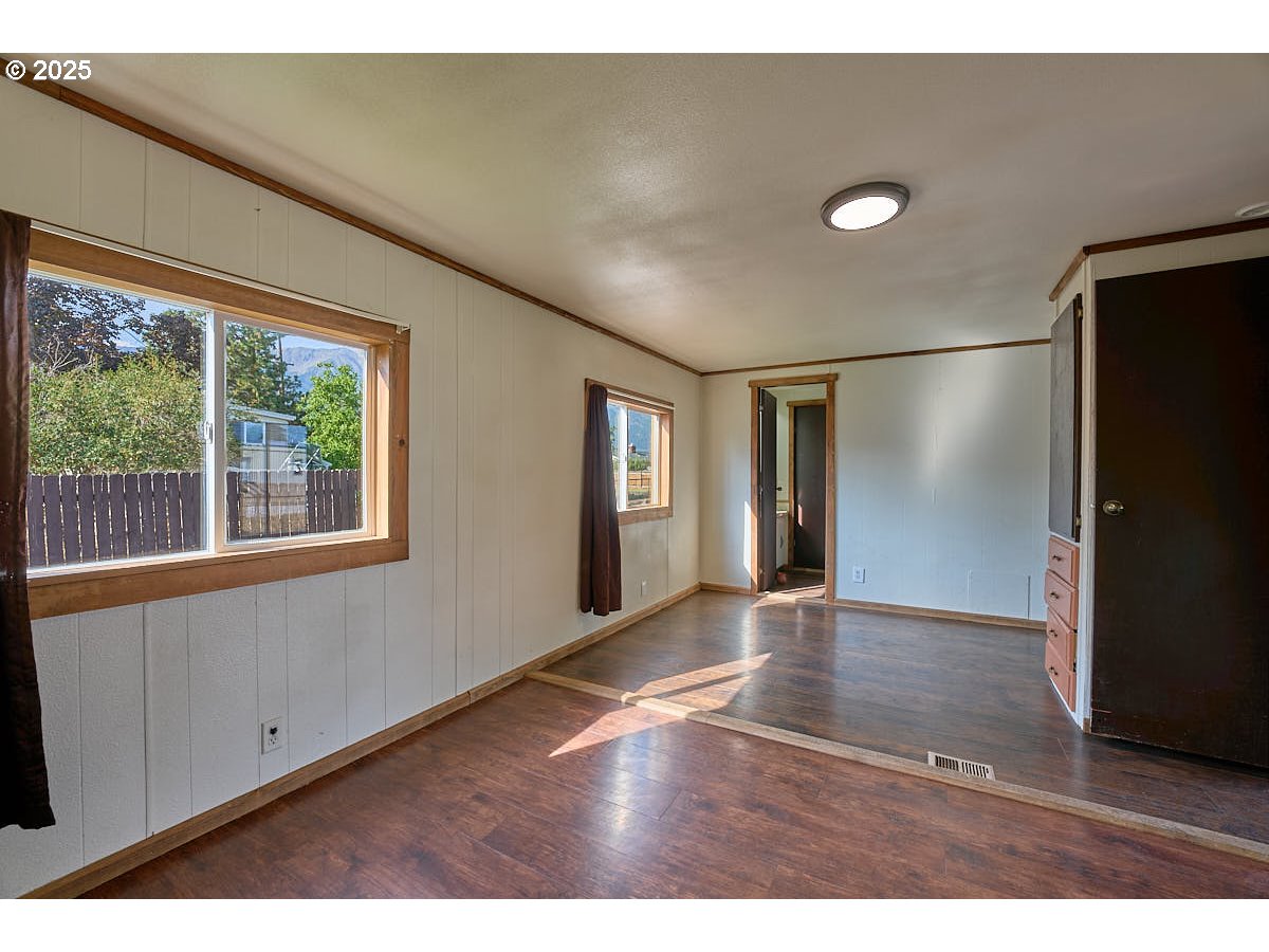 402 South East Street Joseph, OR 97846 - Photo 12 of 22 a view of an empty room with window and wooden floor