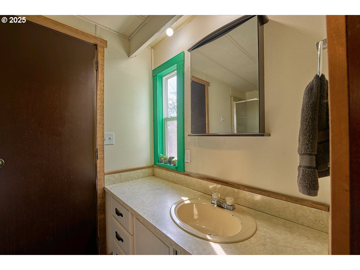 402 South East Street Joseph, OR 97846 - Photo 14 of 22 a bathroom with a sink and a mirror